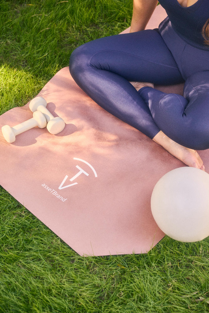Woman ready for practice on a luxury camel yoga mat with soft-touch suede surface outdoors