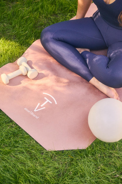 Woman ready for practice on a luxury camel yoga mat with soft-touch suede surface outdoors