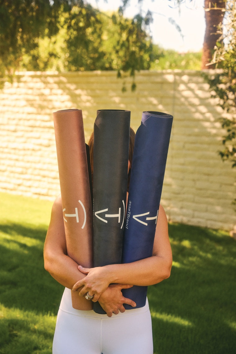 Lightweight 3mm machine-washable yoga mats by The Asset Brand in camel, black, and blue